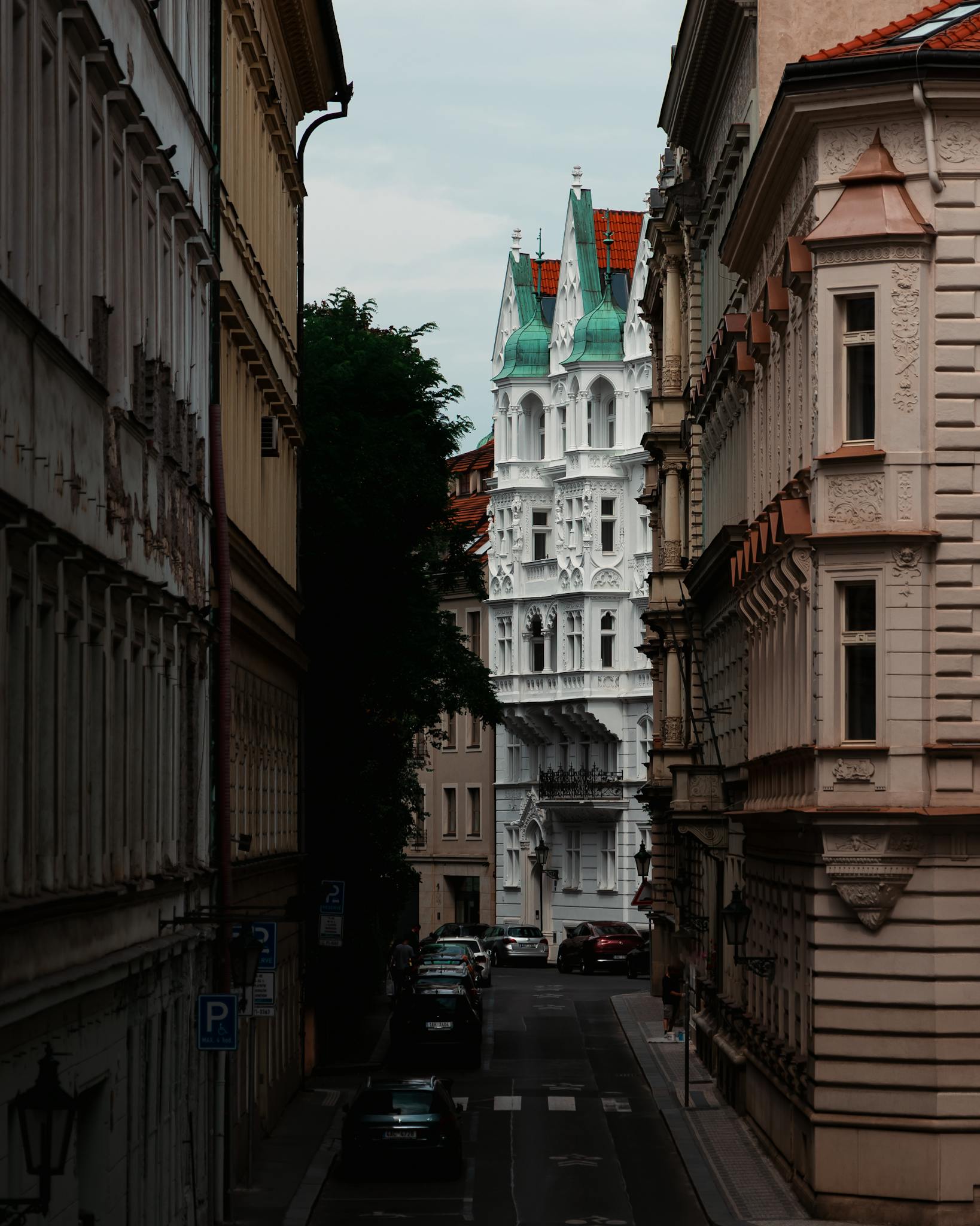 Explore a picturesque European street lined with medieval and historic architecture, ideal for travel enthusiasts.